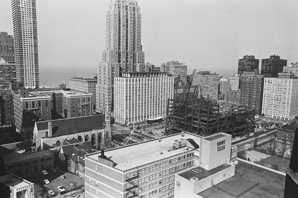 Aerial view of water tower and skyscraper construction - Bob Langer for Chicago Sun-Times