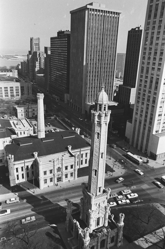 Aerial view of water tower and skyscraper construction - Bob Langer for Chicago Sun-Times