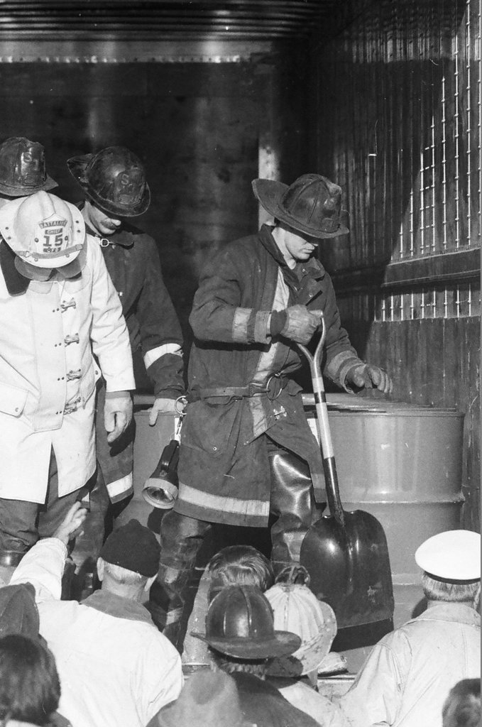 Firefighters remove leaking drums from trailer - Jack Lenahan for Chicago Sun-Times