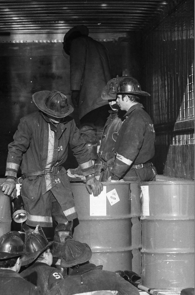 Firefighters remove leaking drums from trailer - Jack Lenahan for Chicago Sun-Times