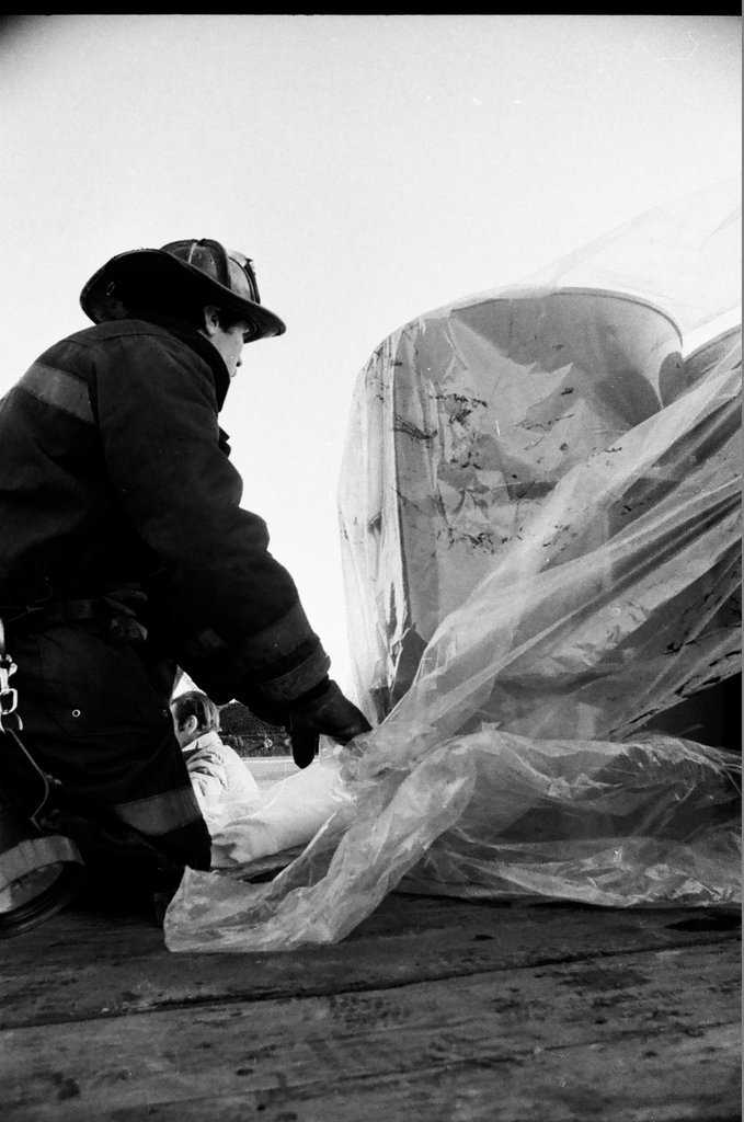 Firefighters remove leaking drums from trailer - Jack Lenahan for Chicago Sun-Times