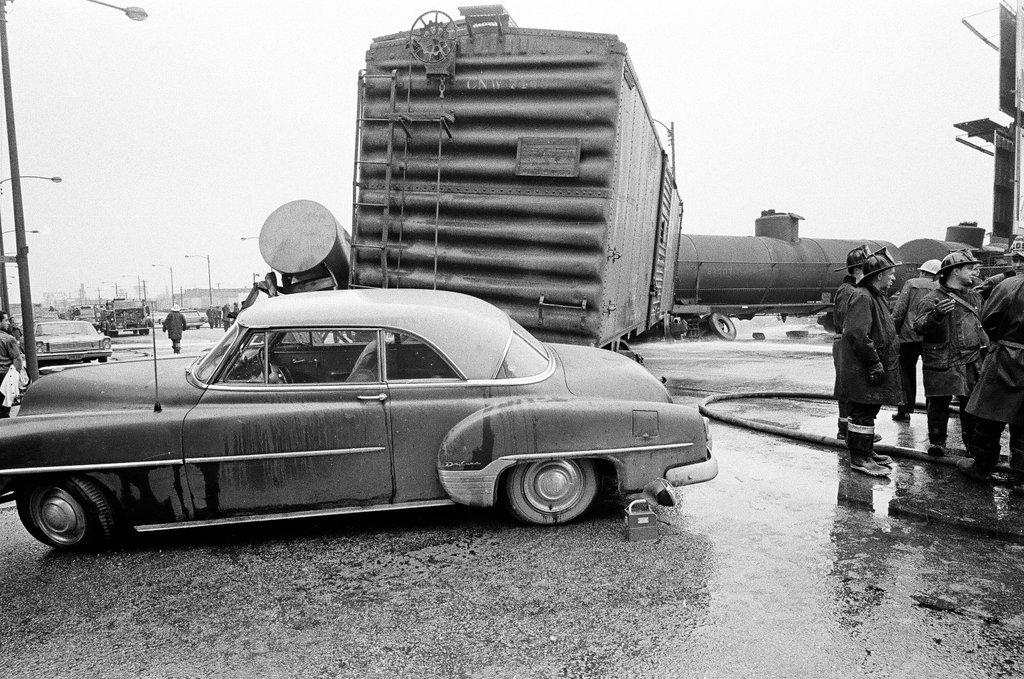Derailed train stopped in the street - Chicago Sun-Times
