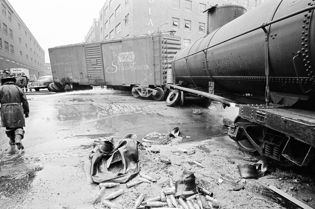 Derailed train stopped in the street - Chicago Sun-Times