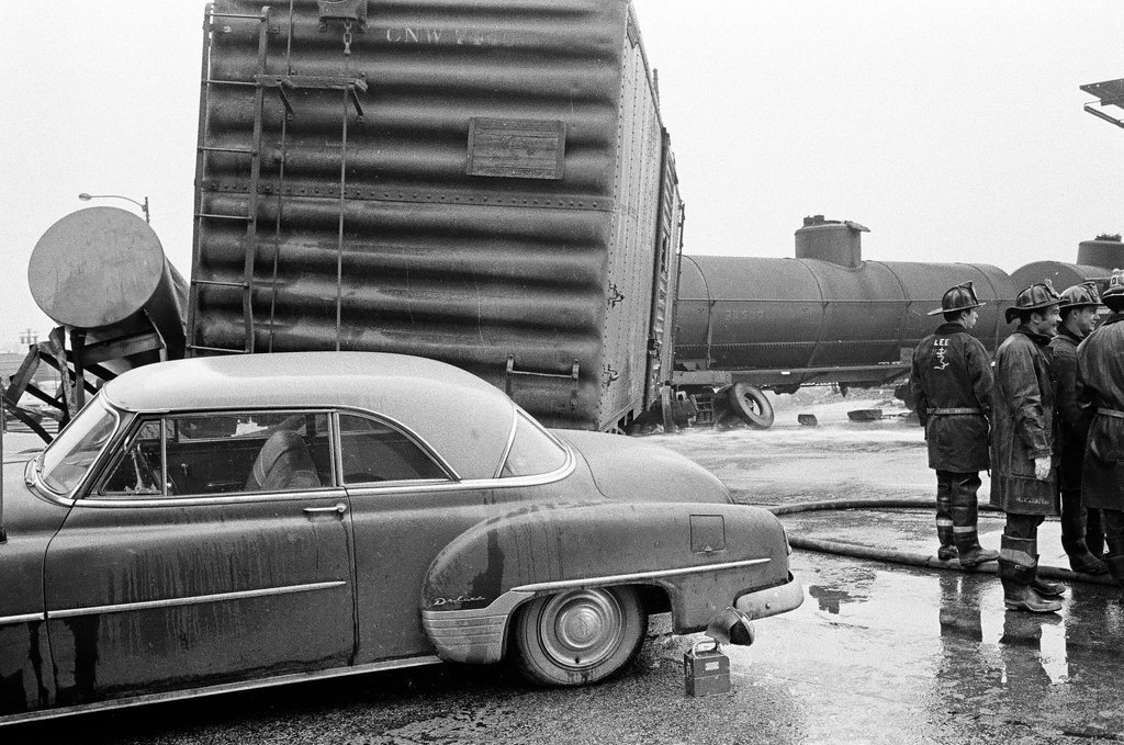 Derailed train stopped in the street - Chicago Sun-Times