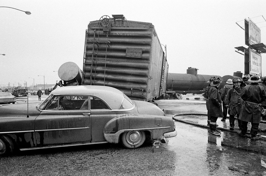 Derailed train stopped in the street - Chicago Sun-Times