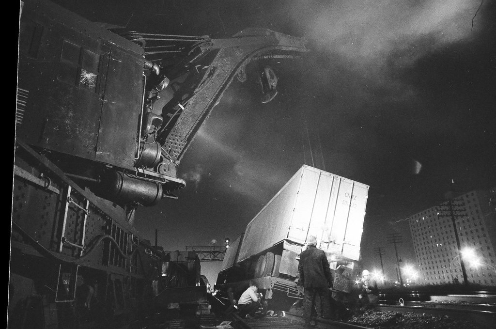 Overturned rail car carrying a semi truck - Chicago Sun-Times
