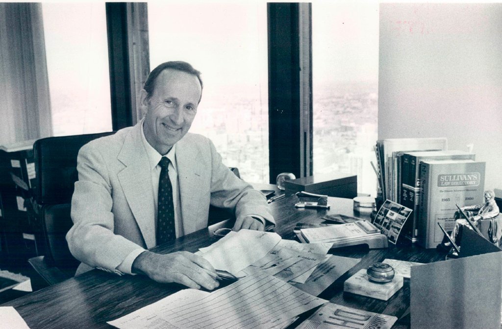 Thomas Sullivan seated at a desk - John White for Chicago Sun-Times