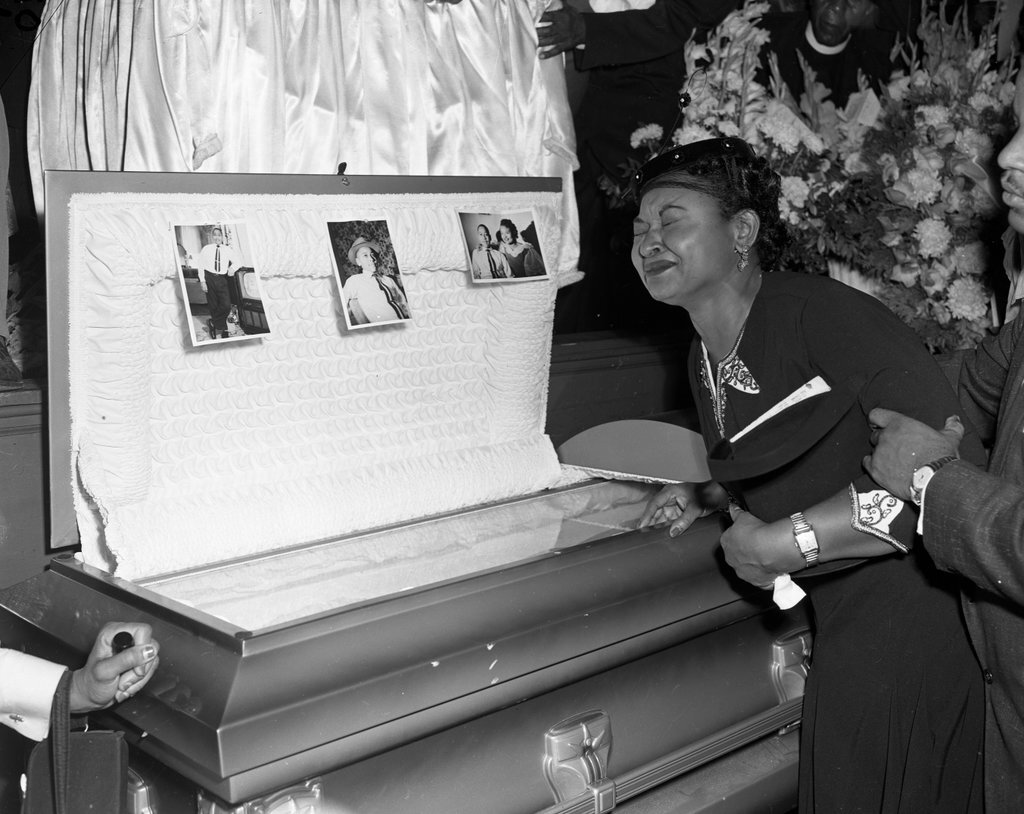 Mamie Bradley grieving over the casket of her son, Emmett Till - Chicago Sun-Times