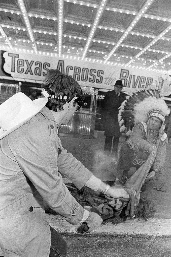 Basil F. Heath promoting the film Texas Across the River - Chicago Sun-Times