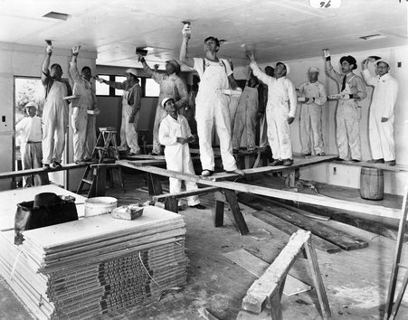 Workers installing a gypsum board - Hedrich-Blessing