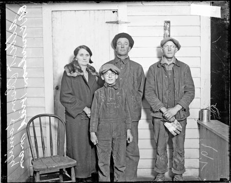 Clara Olson murder case with Albert Olson family standing on a porch in Prairie Du Chien, Wisconsin, facing the camera - Chicago Daily News, Inc.