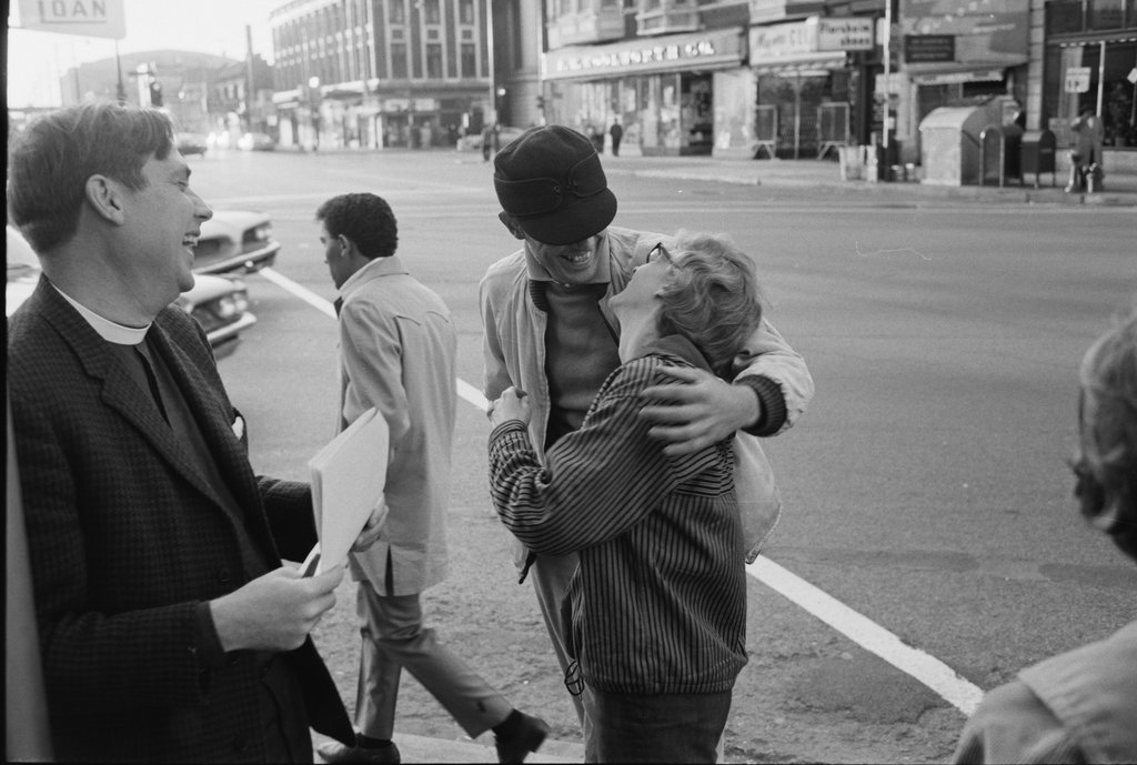 Two people talking at Ogden Avenue and Madison Street - Haun, Declan, 1937-1994