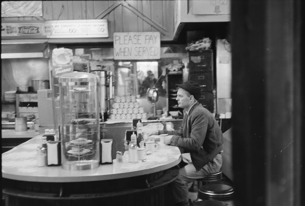 Person sitting at a diner counter - Haun, Declan, 1937-1994