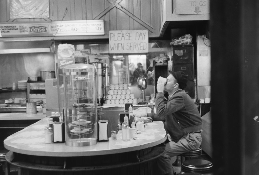 Person sitting at a diner counter - Haun, Declan, 1937-1994