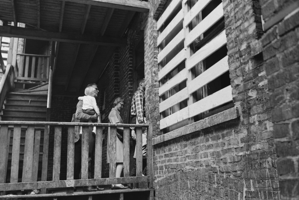 People entering a building from the rear stairs - Haun, Declan, 1937-1994