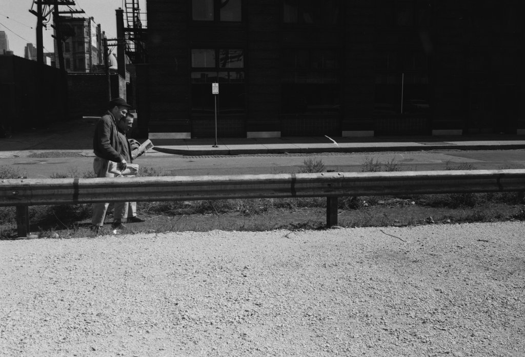 Two people walking next to a guardrail - Haun, Declan, 1937-1994