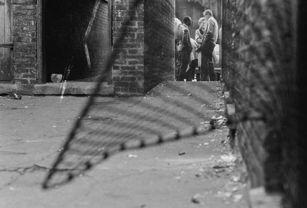 People standing next to an alley - Haun, Declan, 1937-1994