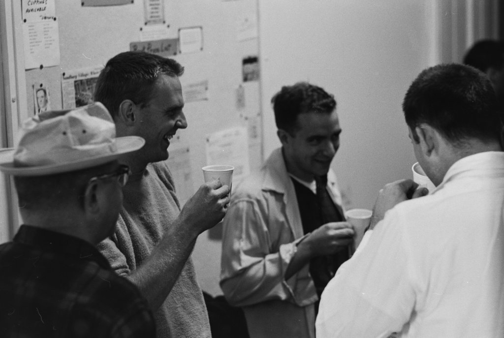 Group of people enjoying refreshments and conversing - Haun, Declan, 1937-1994