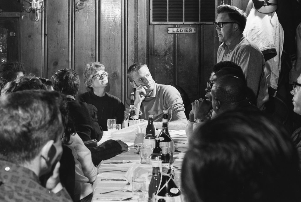 Group of people in a meeting at a bar or restaurant - Haun, Declan, 1937-1994