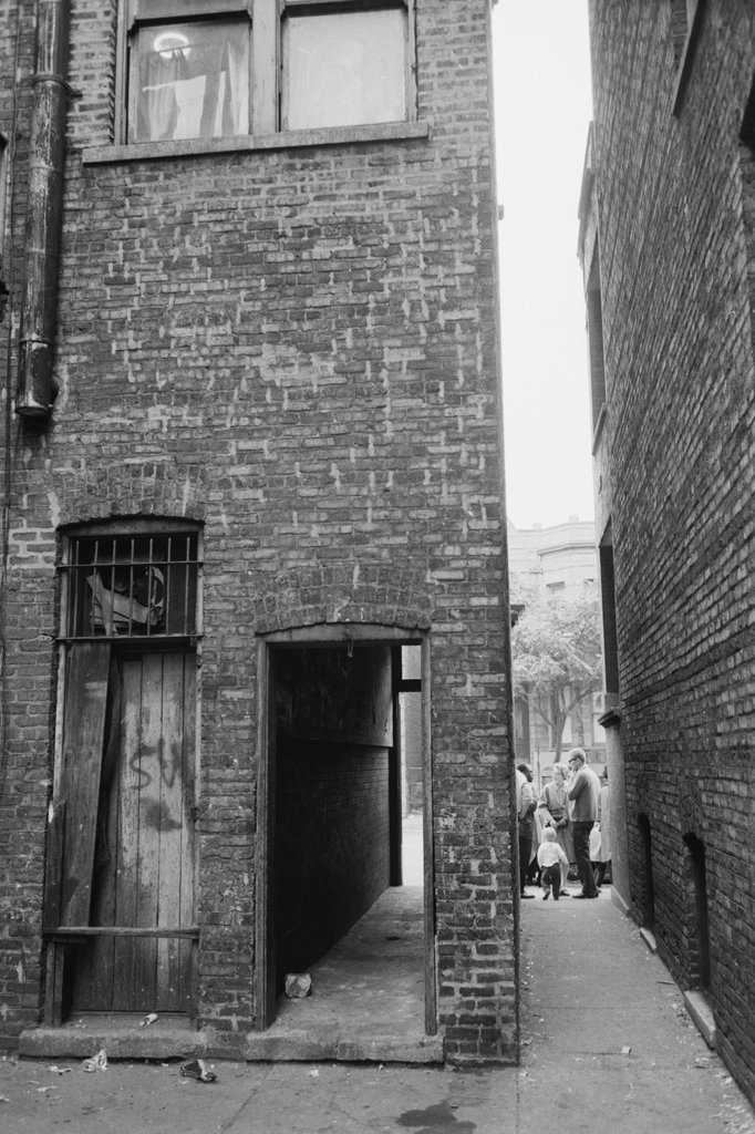 People standing next to an alley - Haun, Declan, 1937-1994