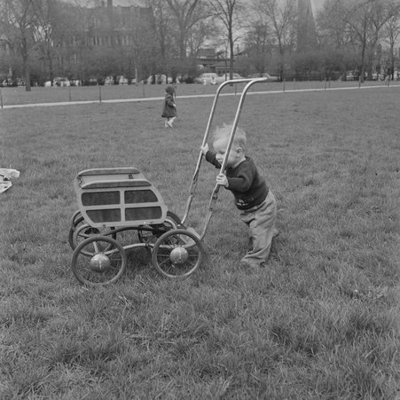 Child pushing a carriage near the 300 block of Normal Parkway - Mead, Mildred
