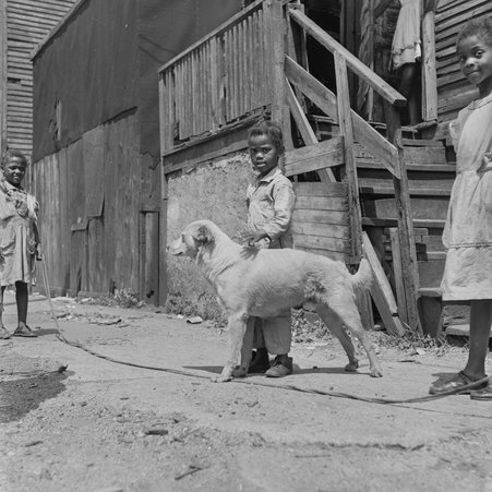 Children standing outside 148 West 46th Street in Fuller Park - Mead, Mildred