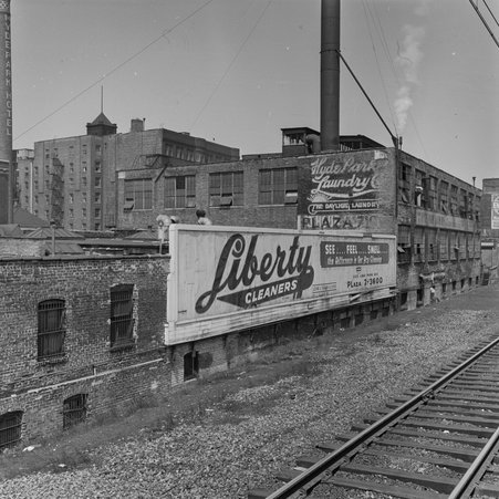 Billboard for Liberty Cleaners next to tracks in Hyde Park-Kenwood - Mead, Mildred