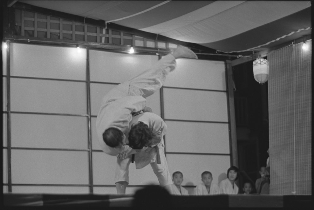 People dressed and performing in traditional Japanese costume - Flerlage, Raeburn, 1915-2002