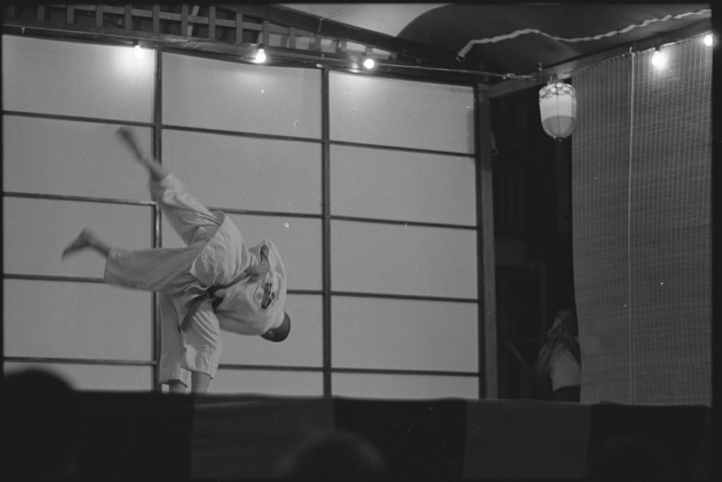 People dressed and performing in traditional Japanese costume - Flerlage, Raeburn, 1915-2002