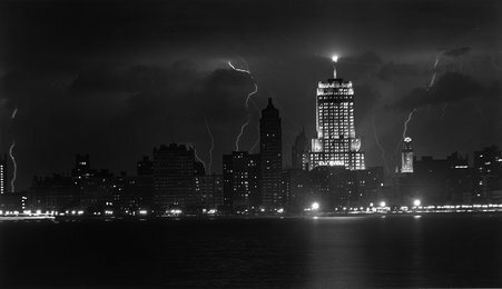 Exterior night view of Palmolive Building with lightning - Hedrich-Blessing