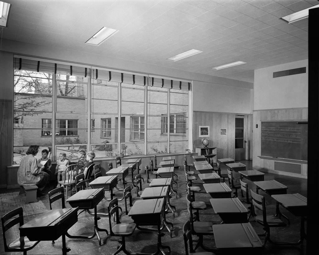 Interior view of classroom with desks, Lower School, Francis W. Parker Elementary School - Hedrich-Blessing