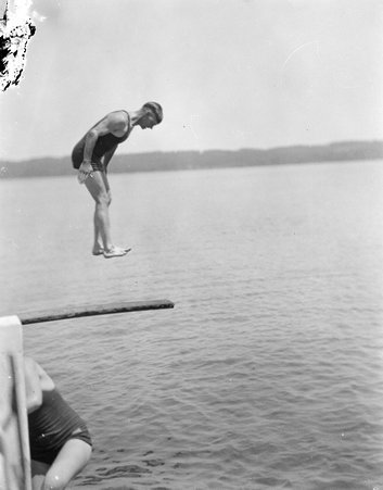 Man jumping on divind board - Trowbridge, Raymond W., 1886-1936