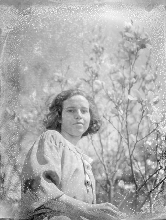 Girl in garden - Trowbridge, Raymond W., 1886-1936