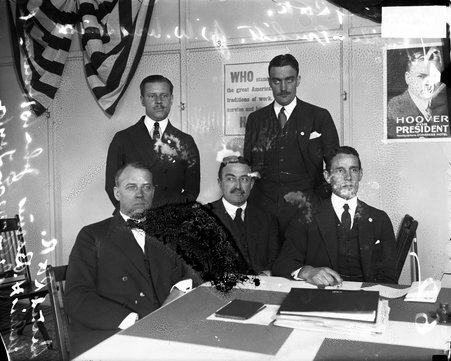 Wilson J. Pritchett, John W. Hallowell, Dr. Alonzo E. Taylor, and Julius H. Barnes gathered around table - Chicago Daily News, Inc.