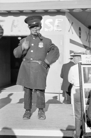 Person of short stature wearing police uniform at Century of Progress - Cook, O. L.