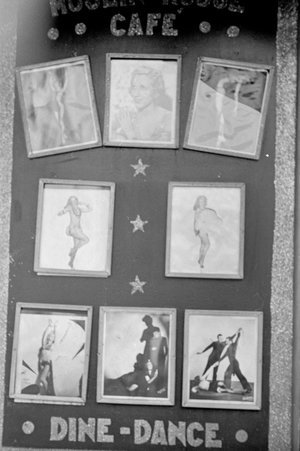 Sign and photographs advertising the Moulin Rouge Cafe performers at Century of Progress - Cook, O. L.