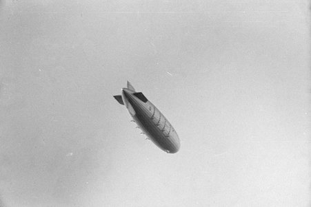 Graf Zeppelin flying above Chicago at Century of Progress - Cook, O. L.
