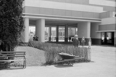 Visitors walk through a building's archway at Century of Progress - Cook, O. L.