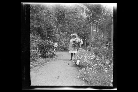 Women and children in garden