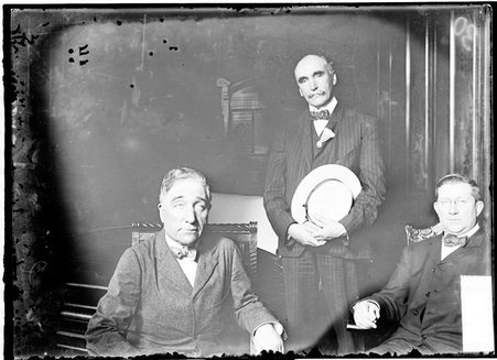 Burke Cochran sitting on left, and Charles Francis Murphy sitting on right, facing the camera in a room - Chicago Daily News, Inc.