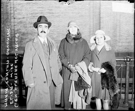 General Eleayar del Valle standing with his wife Elisa and daughter Maria Concha on a railroad platform in a train station - Chicago Daily News, Inc.