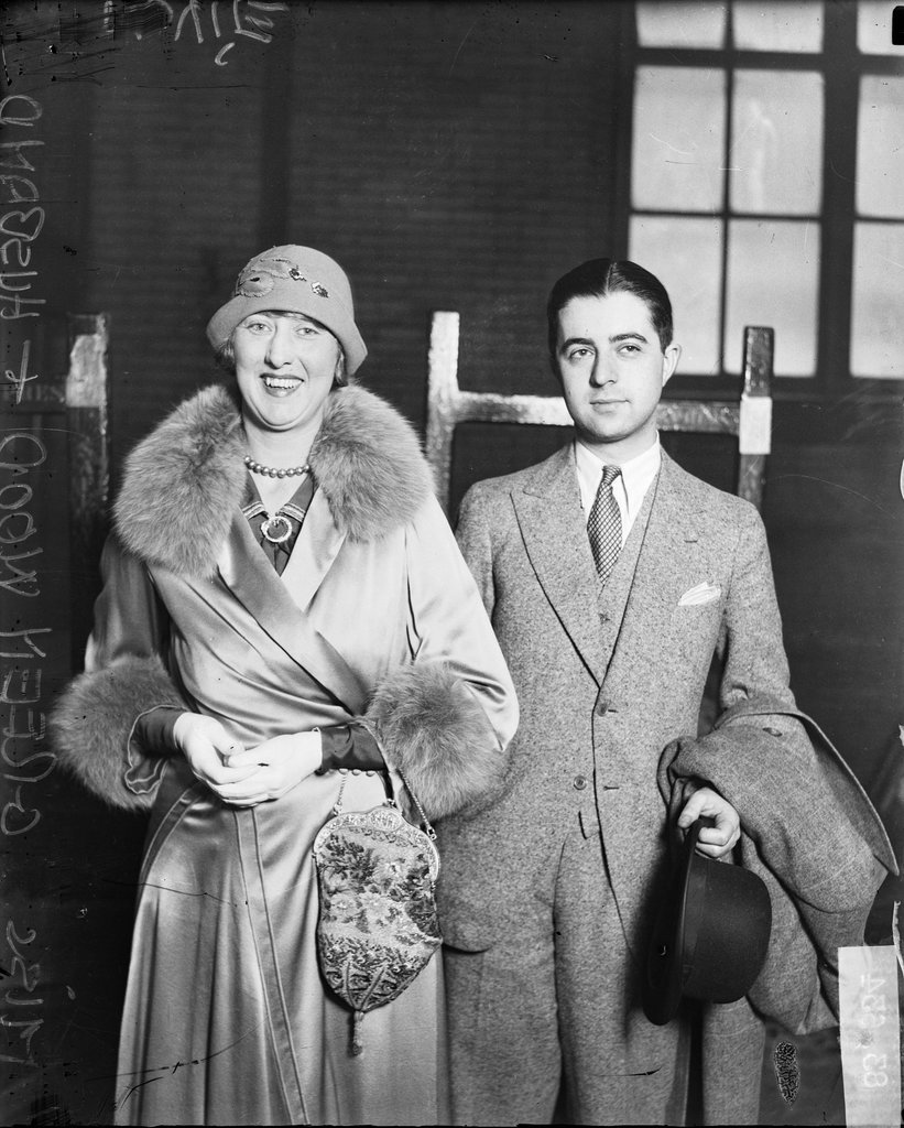 Charlotte Greenwood and her husband standing in a room - Chicago Daily News, Inc.