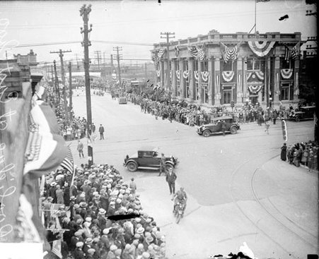 Crowds lining a commercial street in Hammond, Indiana, awaiting the arrival of President Calvin Coolidge on Coolidge Day - Chicago Daily News, Inc.