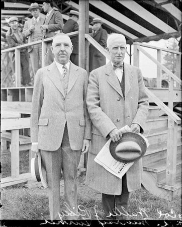 Colonel Walter J. Riley and A. Murray Turner standing in front of a reviewing stand - Chicago Daily News, Inc.
