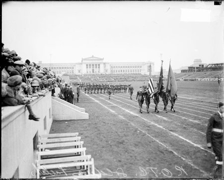 Crowds watching cadets in the Reserve Officers Training Corps marching on the field at Soldier Field - Chicago Daily News, Inc.