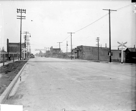 Railroad crossing intersecting Kennedy Street in East Chicago, Indiana - Chicago Daily News, Inc.