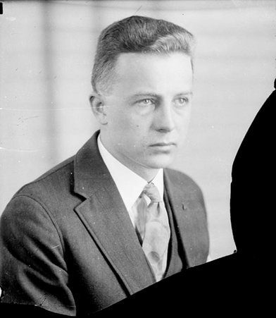 Man looking to the right of the camera and wearing a suit and tie - Chicago Daily News, Inc.
