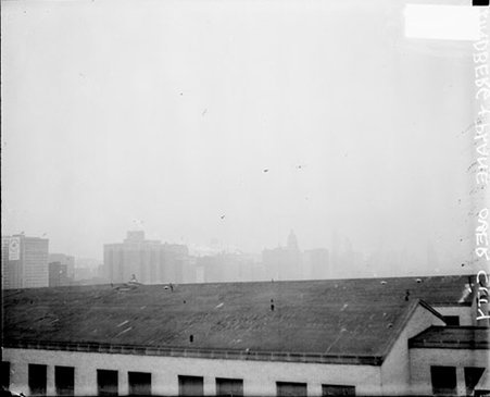 Propeller airplane flying in the sky, piloted by Charles A. Lindbergh - Chicago Daily News, Inc.