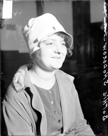 Sophie Hodorow facing to the right of the camera, sitting in a room - Chicago Daily News, Inc.