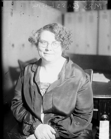 Mrs. Catherine Cassler looking to her left, sitting in a room - Chicago Daily News, Inc.